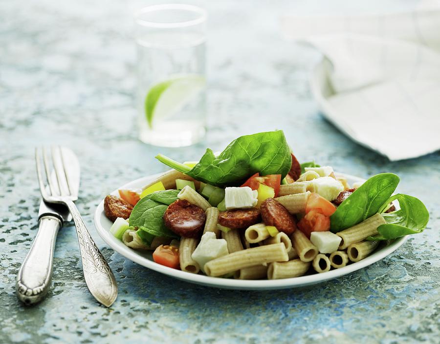Pasta Salad With Sausage, Tomatoes, Feta Cheese And Spinach Photograph by Mikkel Adsbl
