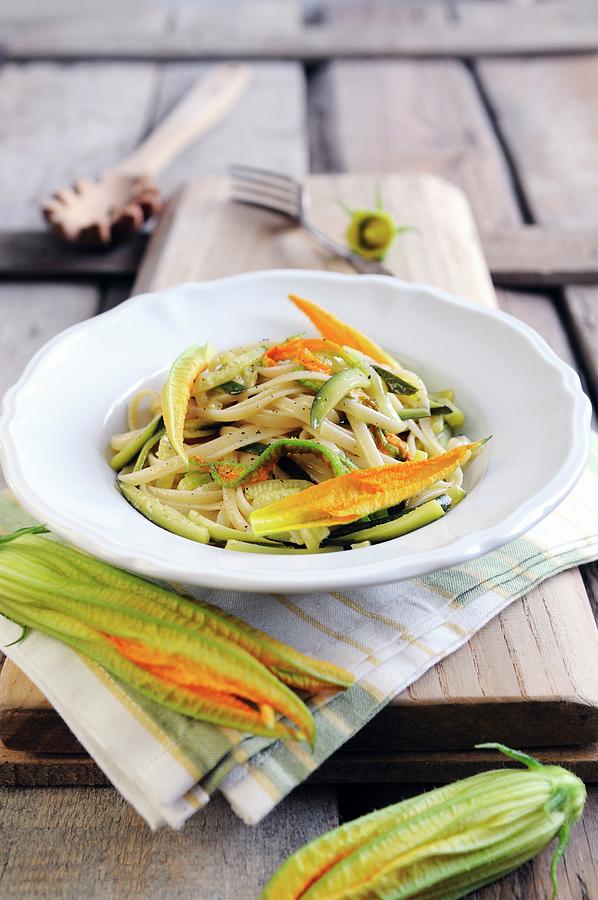 Pasta With Courgettes And Courgette Flowers Photograph by Mario Matassa