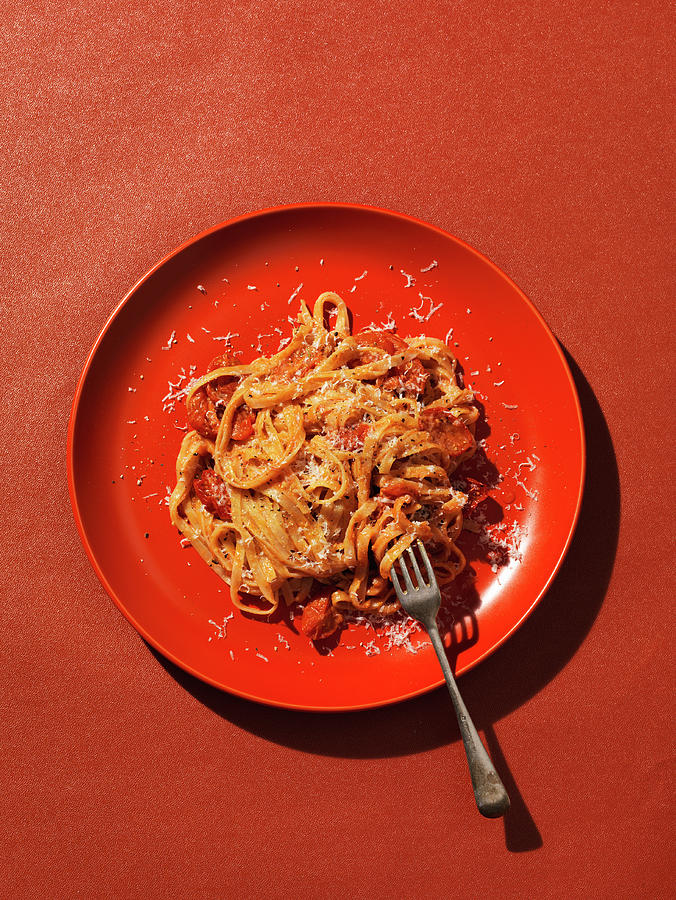 Pasta With Tomato On Red Plate Photograph by Hugh Johnson