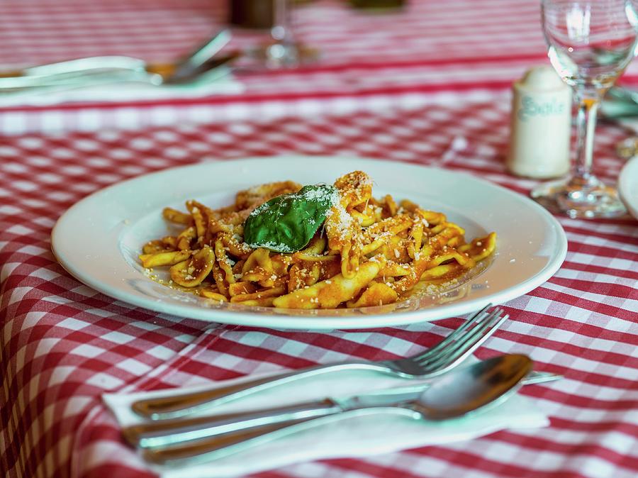 Pasta With Tomato Sauce, Basil And Parmesan Cheese Photograph by Manuel Krug
