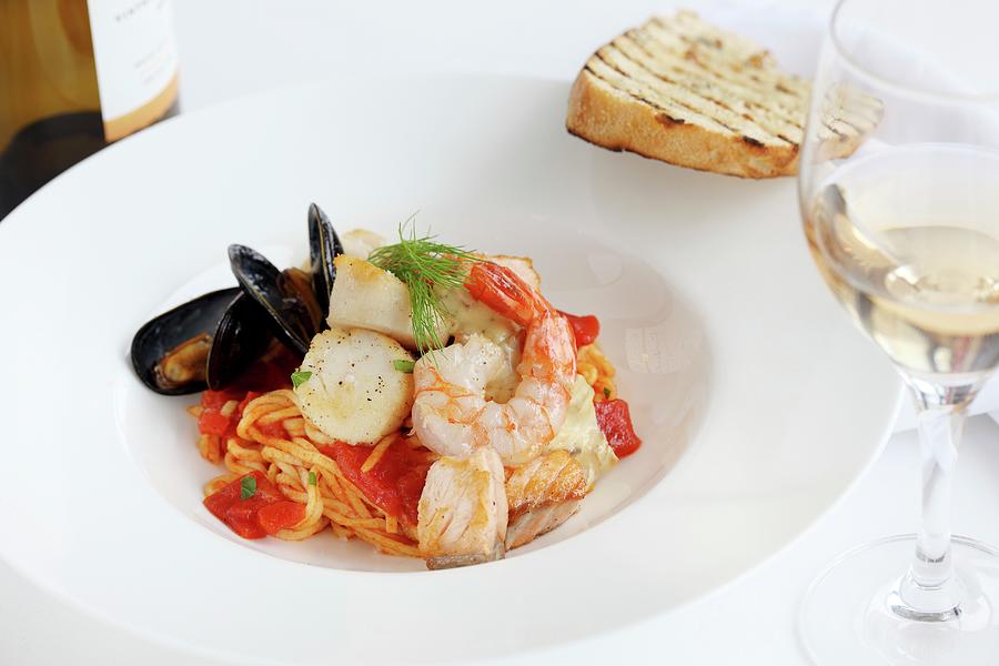 Pasta With Tomatoes, Fish And Seafood Photograph by Perry Jackson