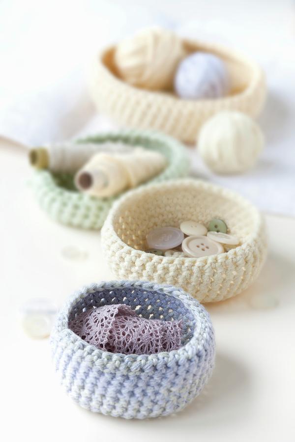Pastel-coloured, Crocheted Baskets Of Haberdashery Items Photograph by Sabine Lscher