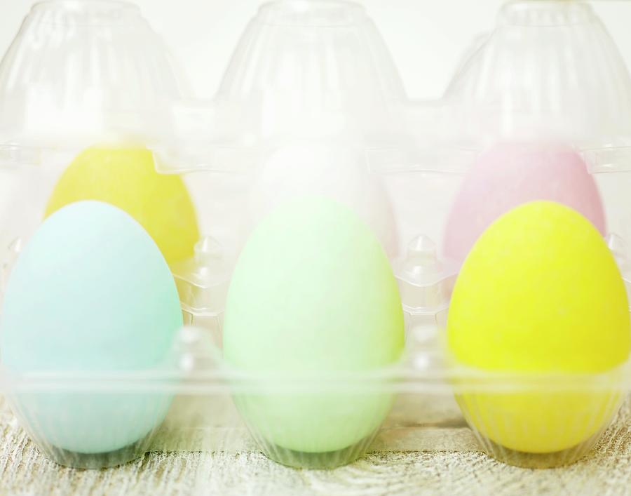Pastel Coloured Easter Eggs In A Plastic Container Photograph by Hugh Johnson