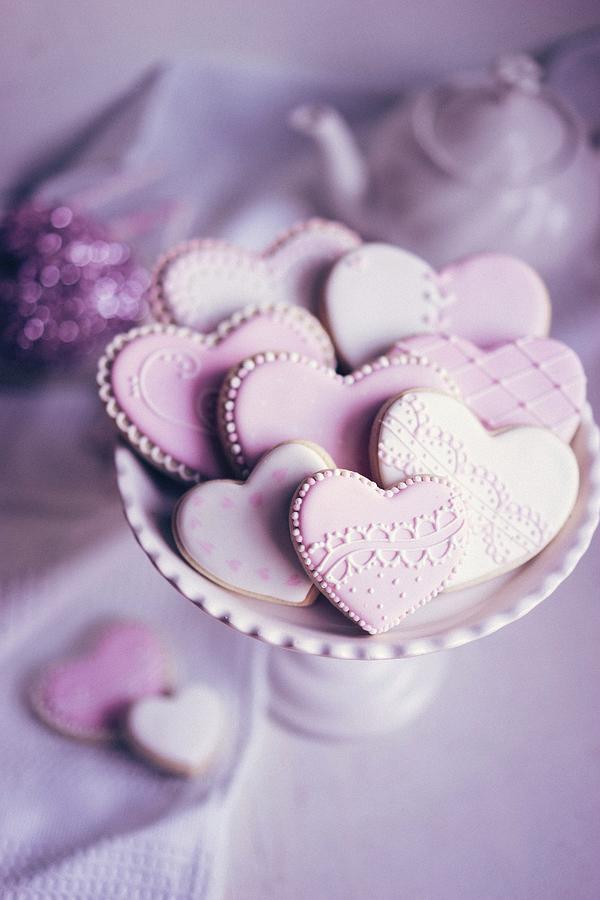 Pastel Coloured Heart-shaped Biscuits On A Biscuit Stand Photograph by Alena Haurylik