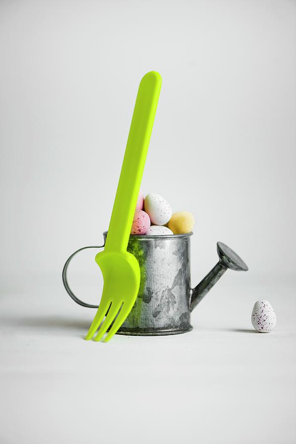 Pastel Sugar Eggs In A Mini Watering Can And Green Fork Photograph by Magdalena Hendey