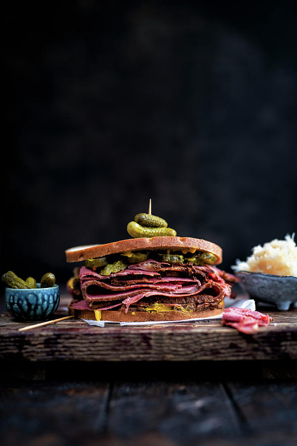 Pastrami Sandwich With Rye Bread And Pickles Photograph by Lucy Parissi