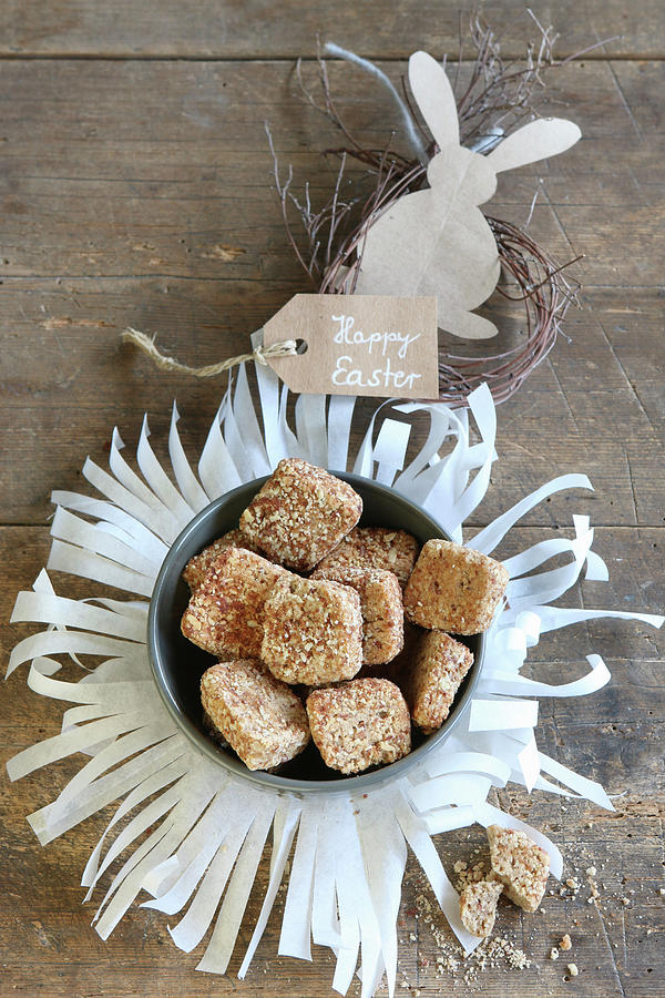 Pastries In Bowl On Fringed Paper Mat With Easter Decoration Photograph by Regina Hippel