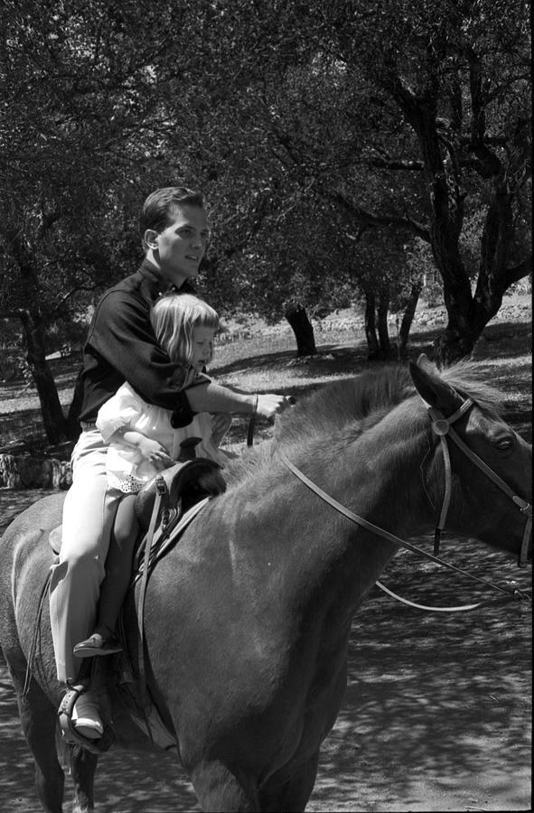 Pat Boone With His Daughter Riding Horse Photograph by Bill Kobrin ...