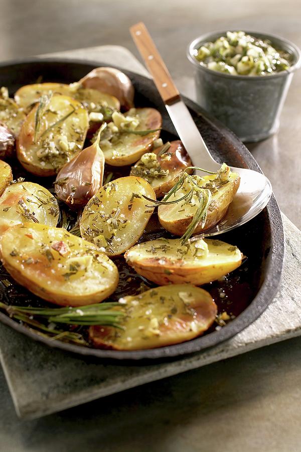 Patate Al Forno roast Potatoes With Garlic And Rosemary Photograph by Pizzi, Alessandra