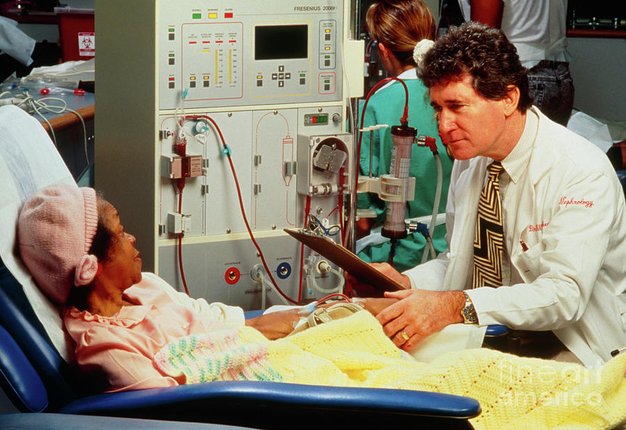 Patient At Kidney Machine With Doctor Attending Photograph by John Greim/science Photo Library