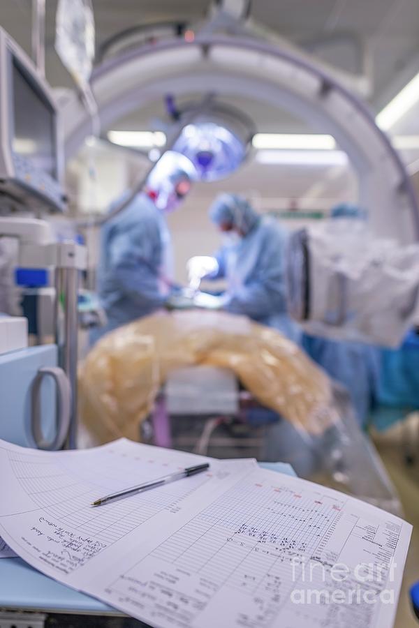 Patient Notes During Spinal Surgery Photograph by Jim Varney/science Photo Library