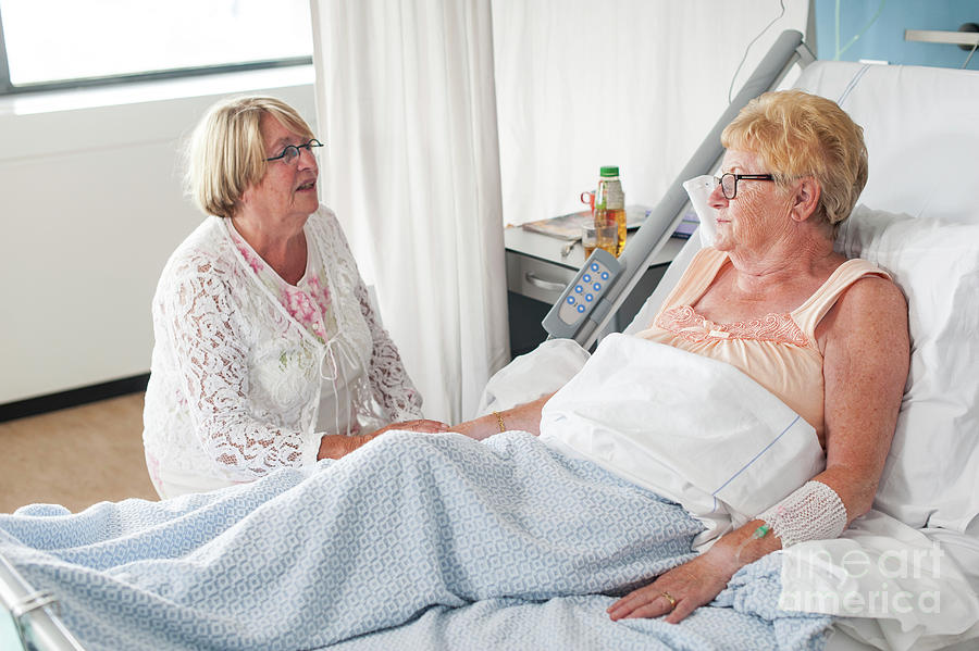 Patient Talking To A Family Member In The Nursing Ward Photograph by Arno Massee/science Photo Library