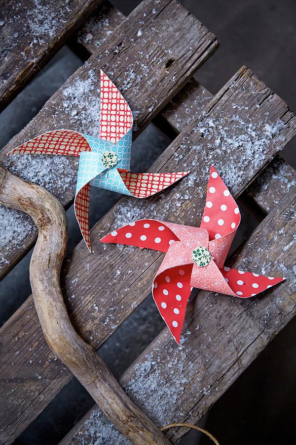 Patterned Paper Windmills On Weathered Wooden Boards Photograph by Martin Slyst