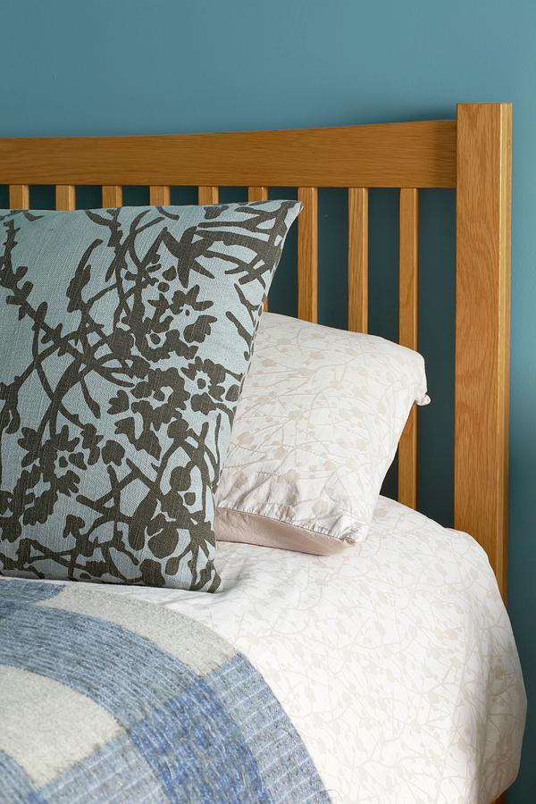 Patterned Pillow On Bed With Wooden Headboard Photograph by Tim Imri