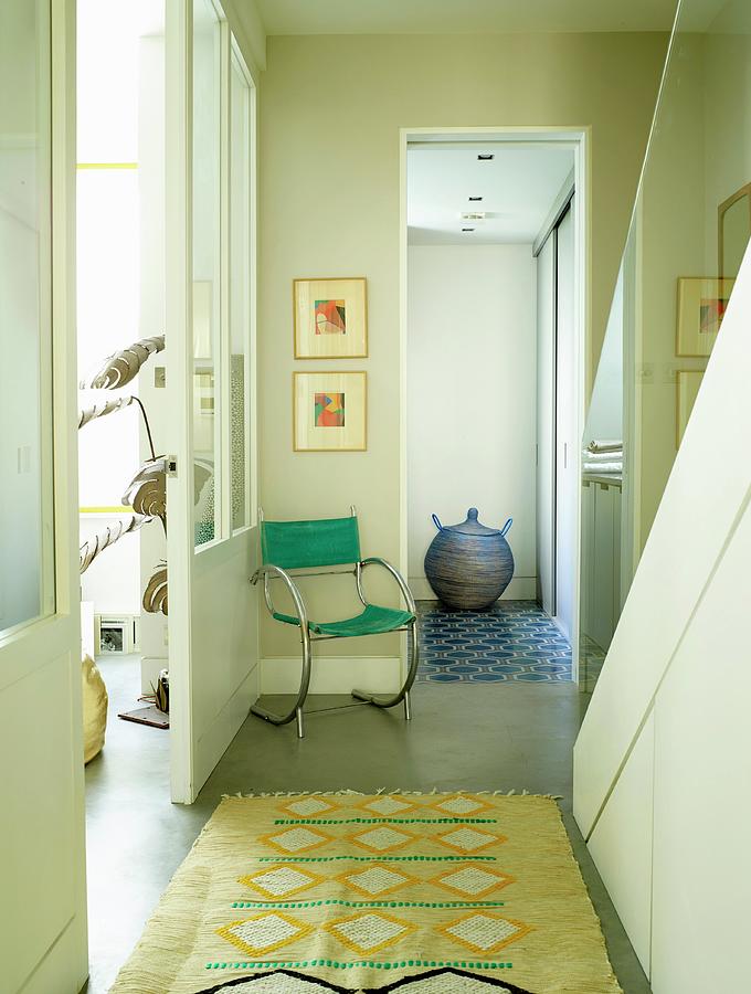 Patterned Rug And Retro Cantilever Chair In Stairwell Photograph by Rachael Smith