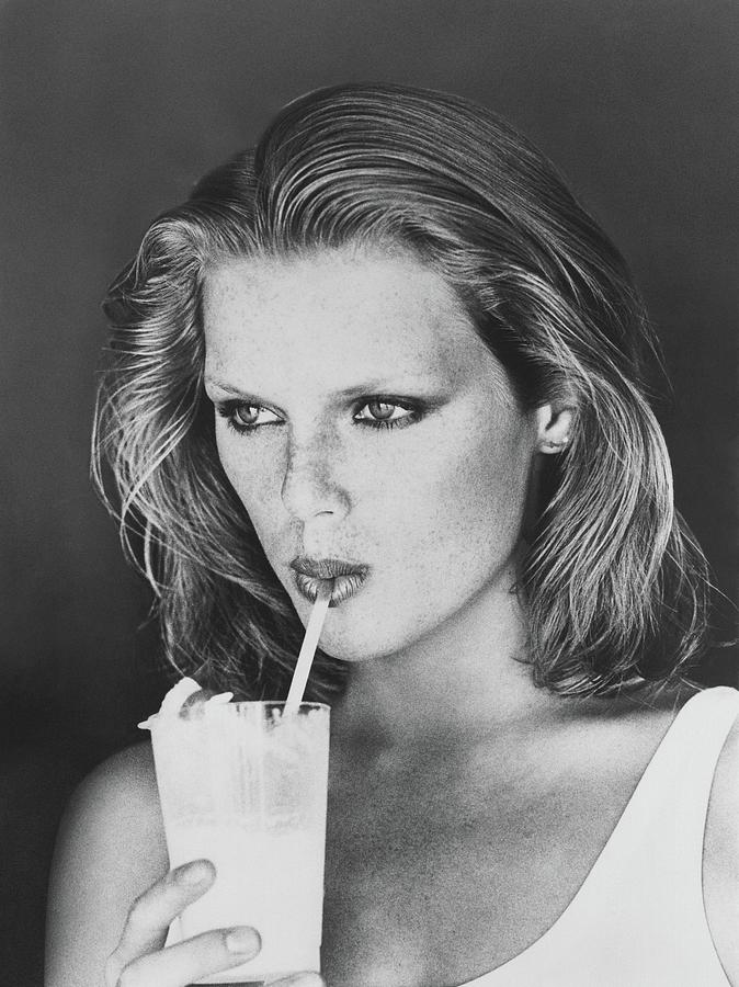 Patti Hansen Sipping A Drink Photograph by Arthur Elgort