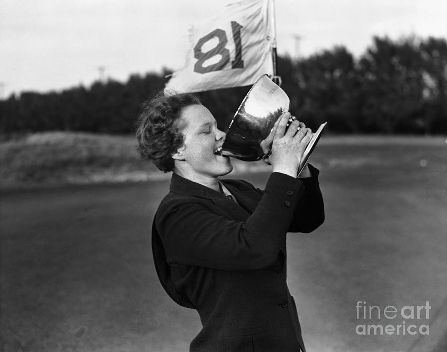 Patty Berg Drinking From Golf Trophy Photograph by Bettmann
