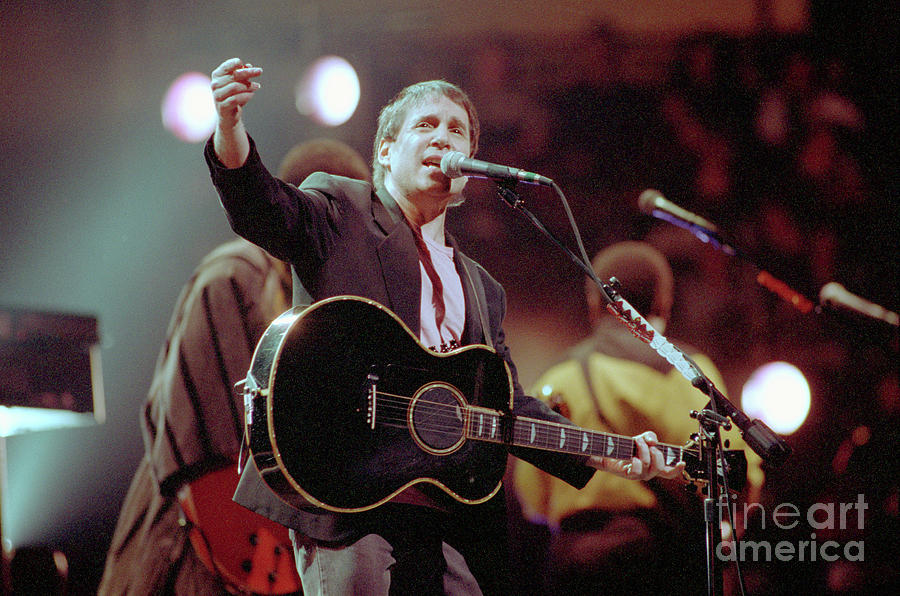Paul Simon Singing On Stage Photograph by Bettmann