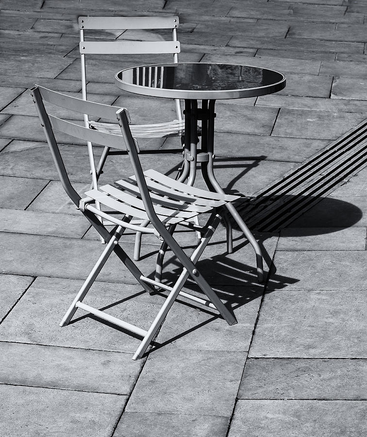 Pavement Table And Chairs Monochrome Photograph by Jeff Townsend