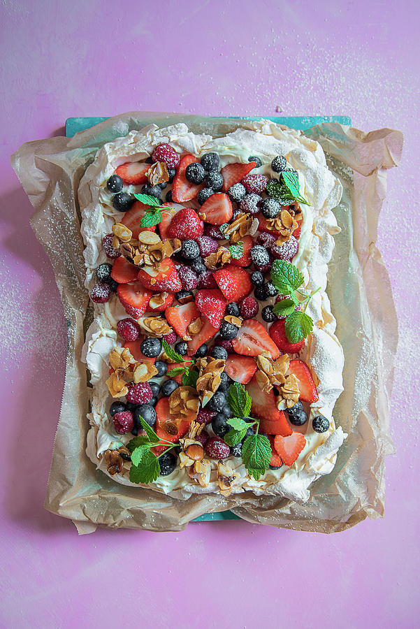 Pavlova With Cream, Fresh Berries And Almond Brittle Photograph by Magdalena Hendey