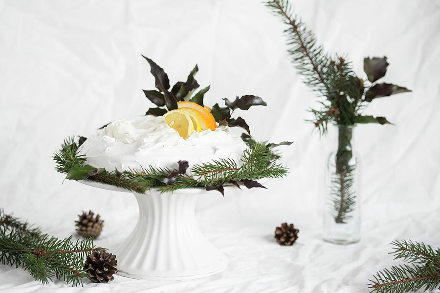 Pavlova With Cream, Lemons And Oranges For Christmas Photograph by Malgorzata Laniak