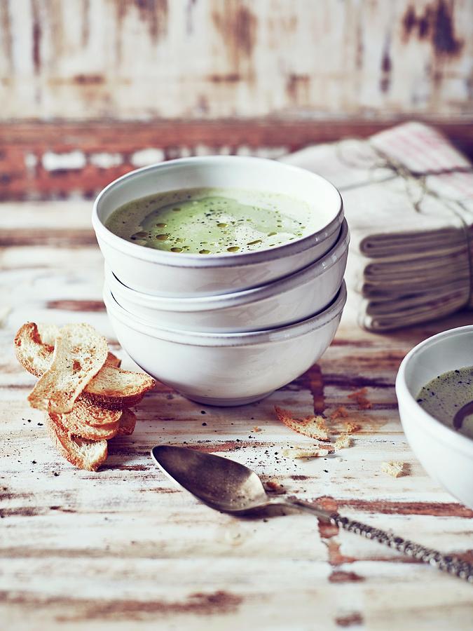 Pea And Parsley Soup With Bread Crisps Photograph by Thorsten Kleine Holthaus