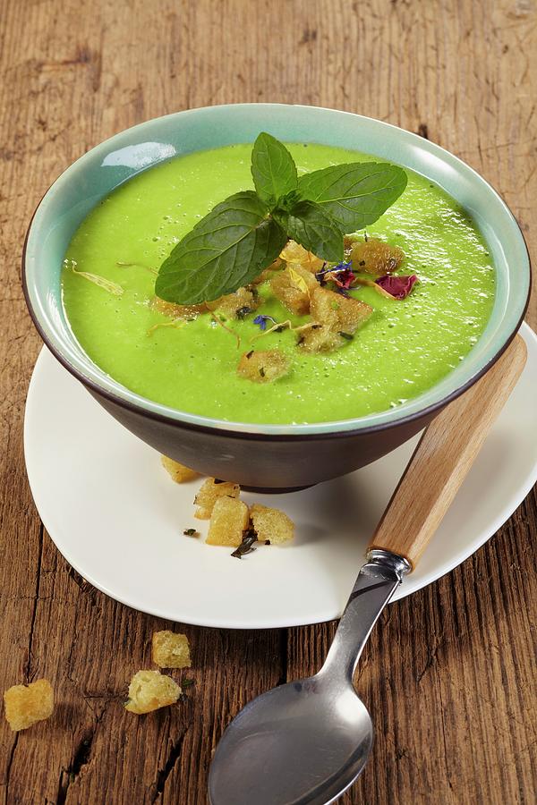 Pea Soup With Croutons And Mint Photograph by Bjrn Llf