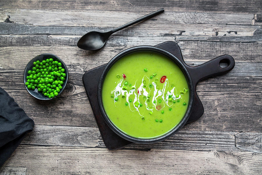 Pea Soup With Spring Onions And Chilli Topping Photograph by Sandra Rsch