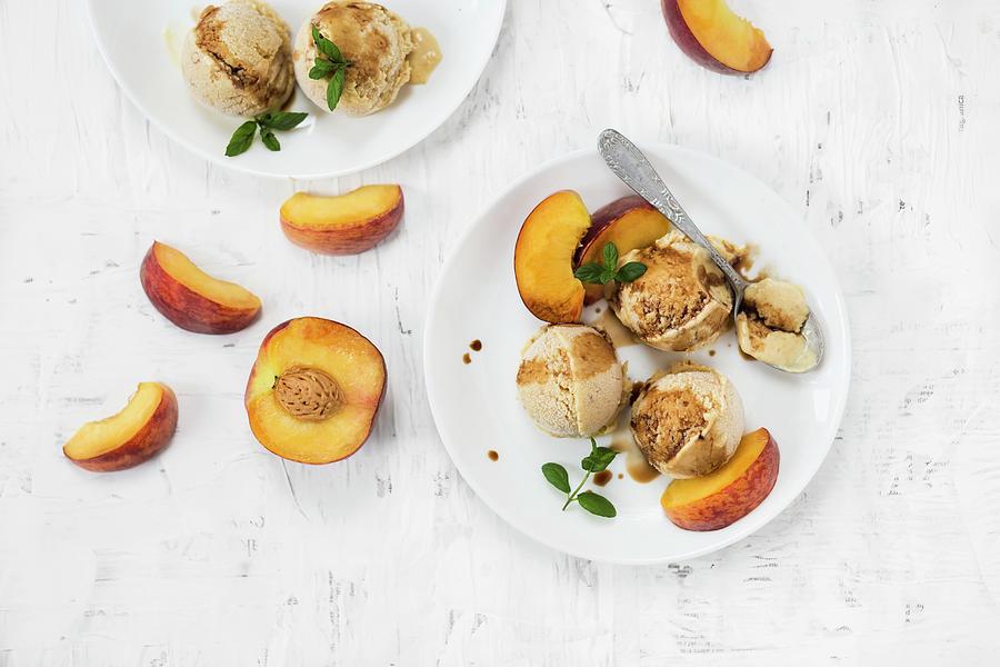 Peach Ice Cream With Balsamic Vinegar And Peach Slices Photograph by Malgorzata Laniak