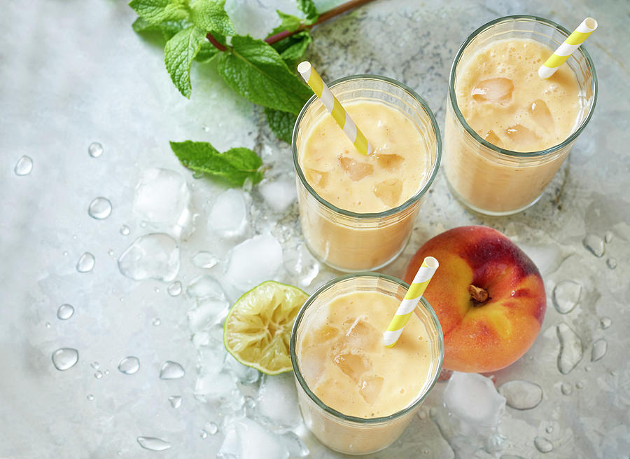Peach Smoothies With Ice Photograph by Stefan Schulte-ladbeck