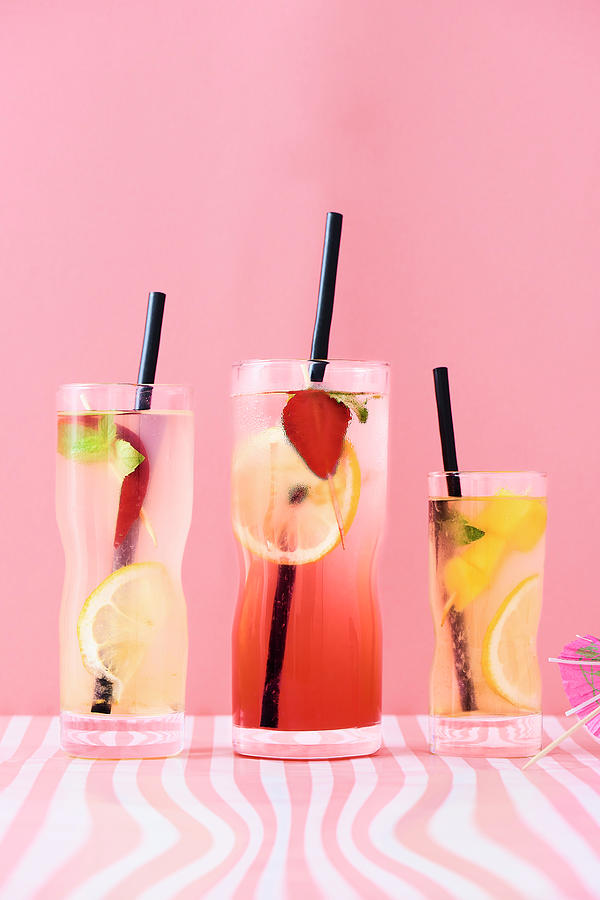 Peach, Strawberry And Mango Lemonades With Mint And Lemon Slices. Photograph by Miha Lorencak