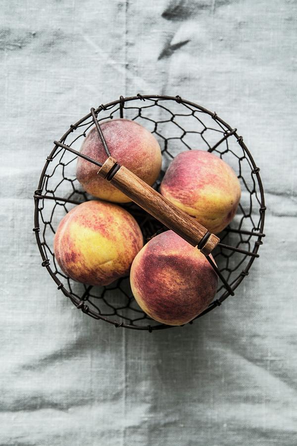 Peaches In A Wire Basket Photograph by The Stepford Husband