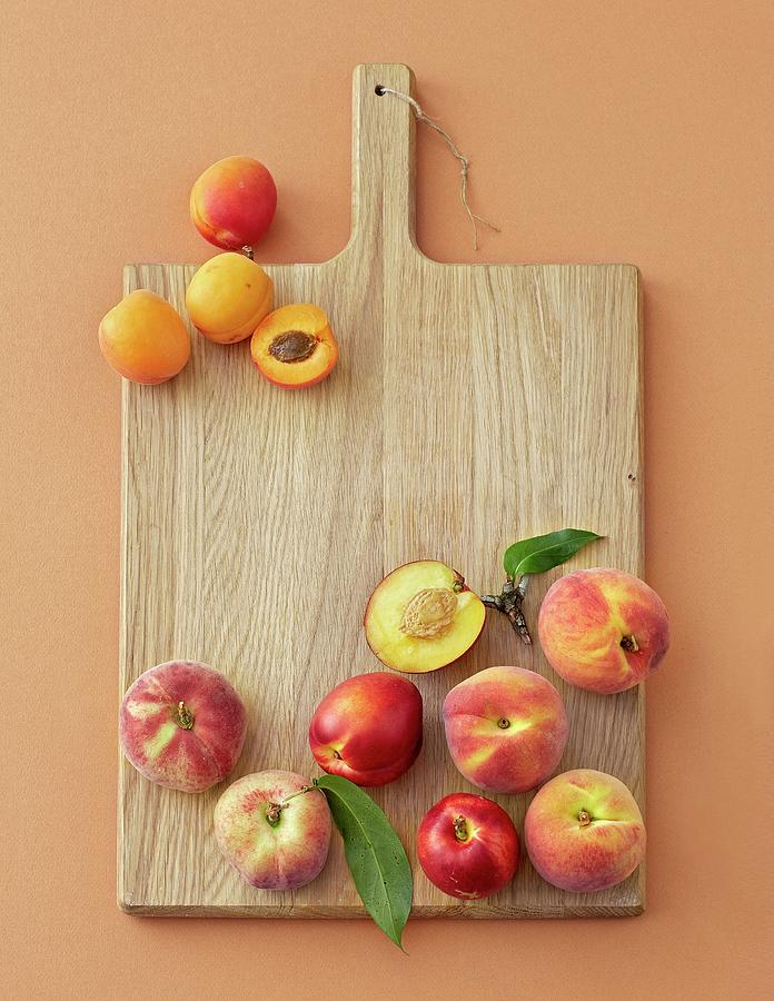 Peaches, Nectarines And Apricots On A Wooden Board Photograph by Jalag / Julia Hoersch