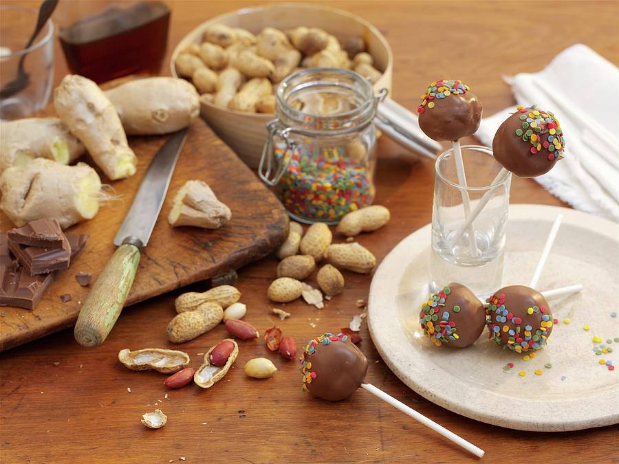 Peanut And Ginger Cake Pops With Sugar Confetti Photograph by Garlick, Ian