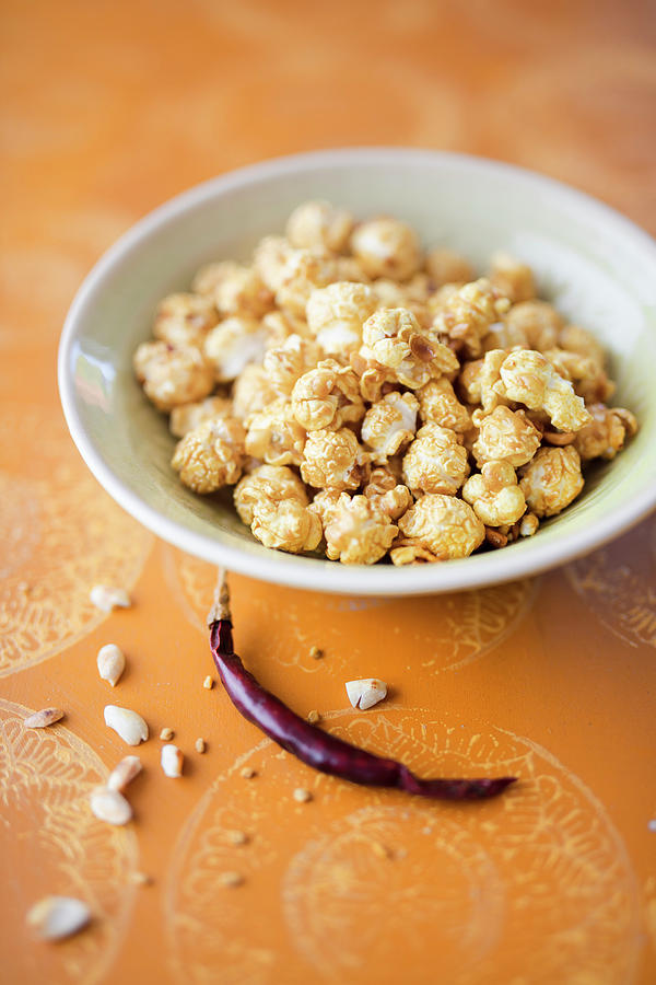 Peanut And Thai Curry Popcorn Photograph by Jan Wischnewski