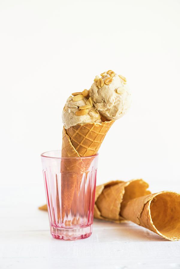 Peanut Butter And Banana Frozen Yoghurt In An Ice Cream Cone Photograph by Hein Van Tonder
