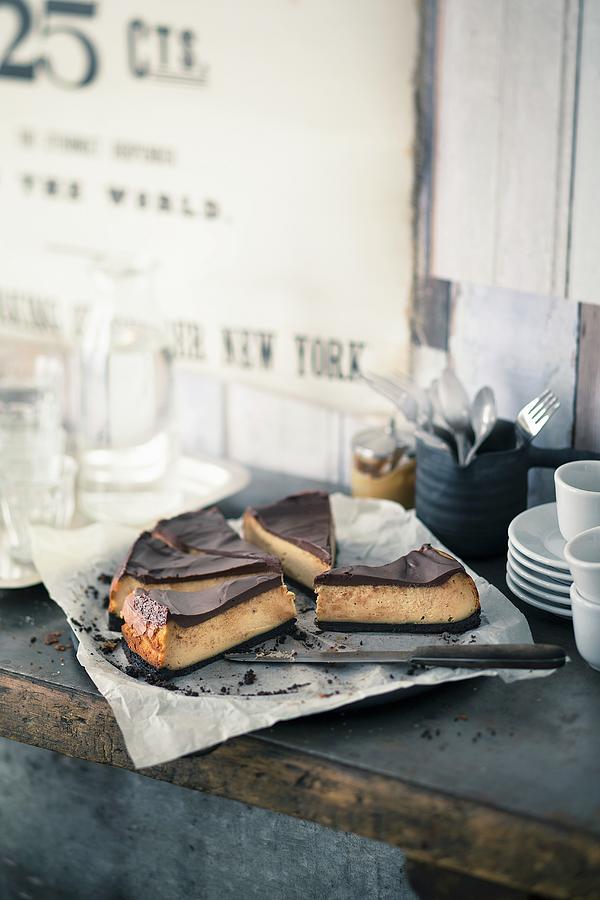 Peanut Butter Cheesecake With Chocolate Glaze Photograph by Jalag / Wolfgang Schardt