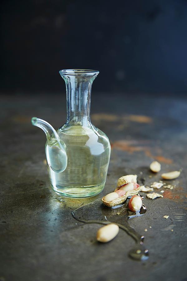 Peanut Oil In A Glass Carafe Photograph by Rafael Pranschke