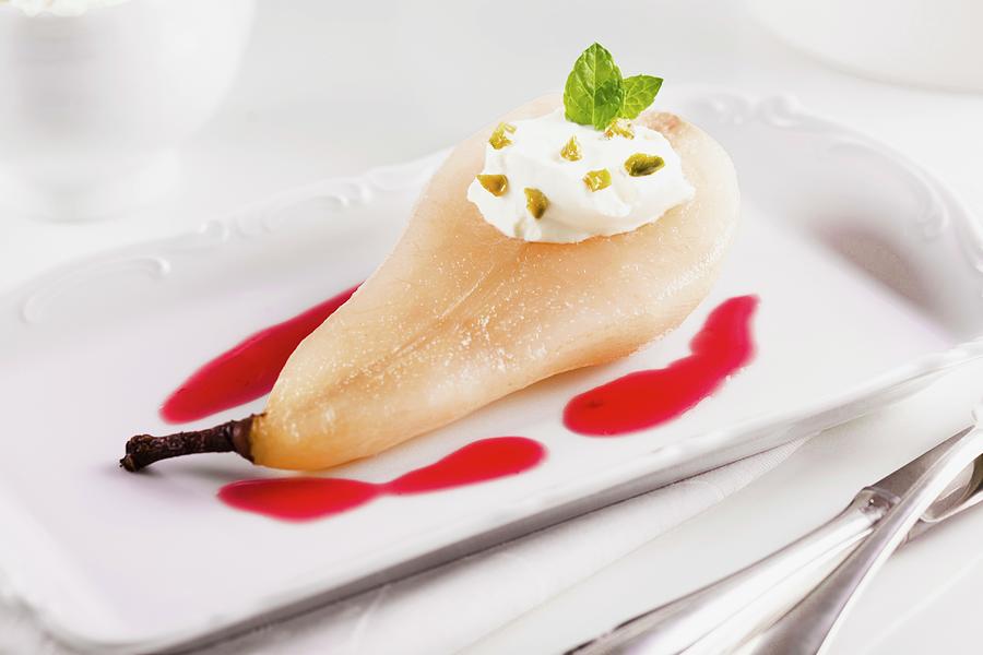 Pear Poached In Amaretto With Cranberry Sauce Photograph by Ilya Shapovalov