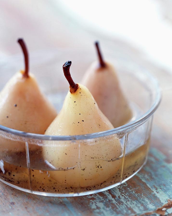 Pears In Vanilla-flavoured Syrup Photograph by Bilic