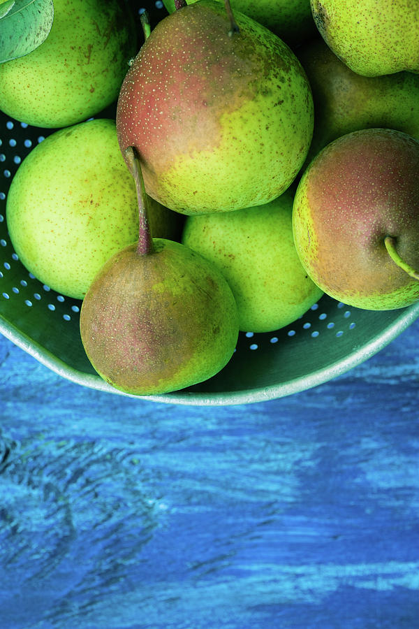 Pears On A Blue Table Photograph