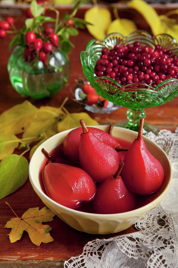 Pears Poached In Cranberry Syrup Photograph by Ekblom, Ulrika