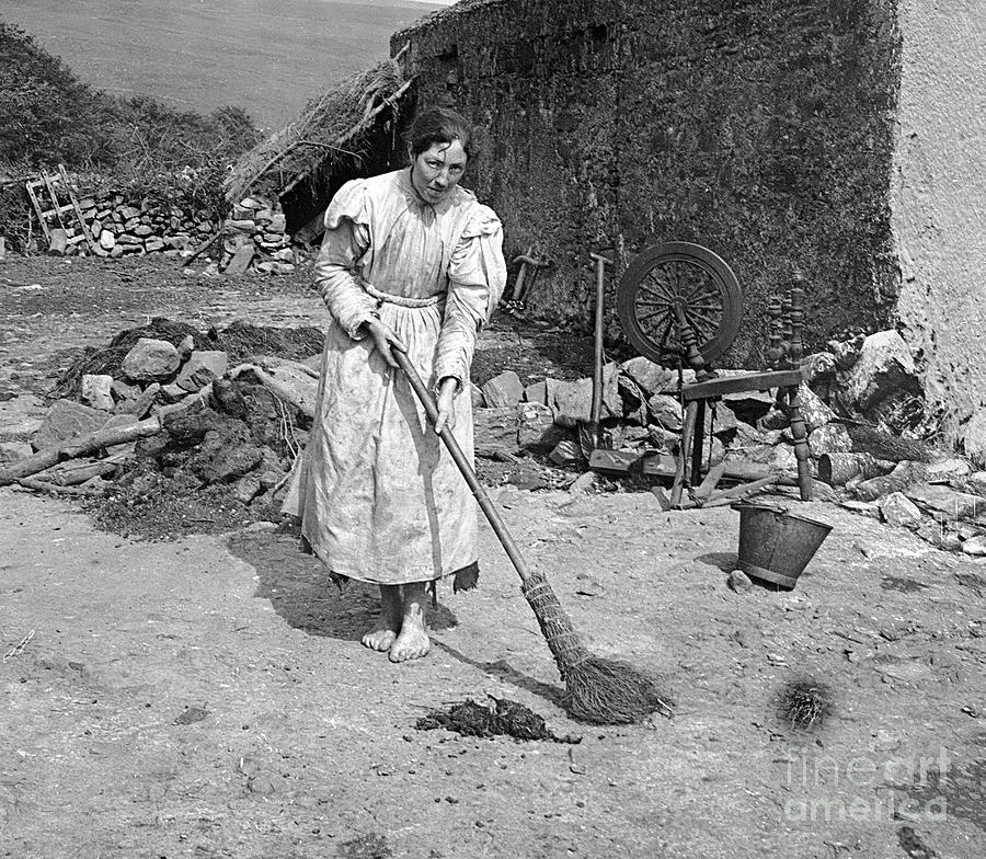 Peasant Woman Sweeping The Yard Photograph by Bettmann