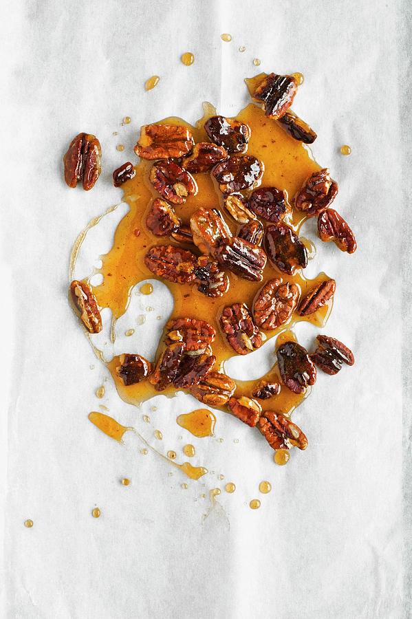Pecan Nut Brittle On A White Baking Parchment seen From Above Photograph by Magdalena Hendey