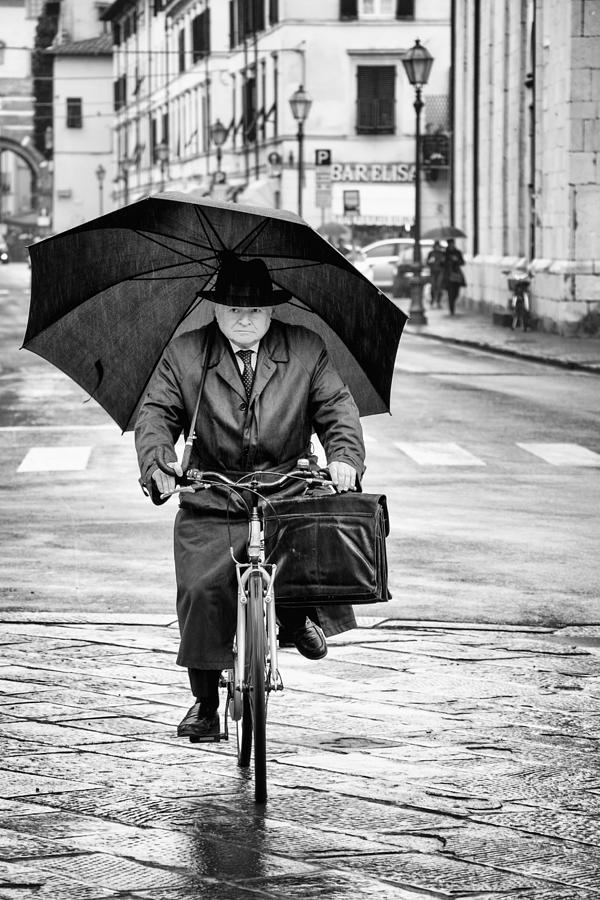 Black And White Photograph - Pedaling In The Rain by Massimo Della Latta