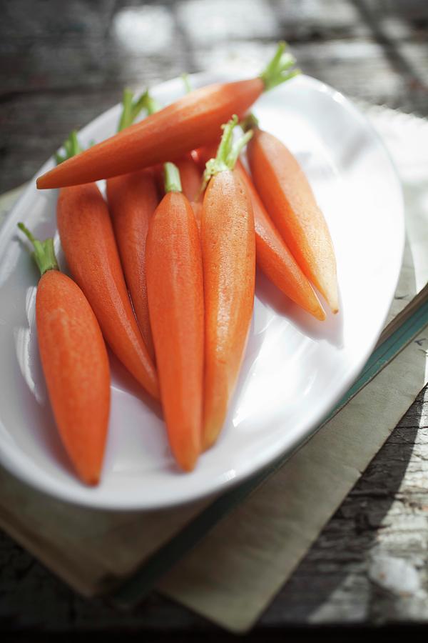 Peeled Baby Carrots On A Plate Photograph by Stepien, Malgorzata