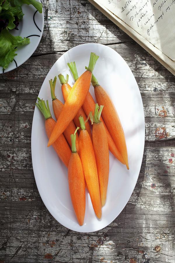 Peeled Baby Carrots On A Plate view From Above Photograph by Stepien, Malgorzata