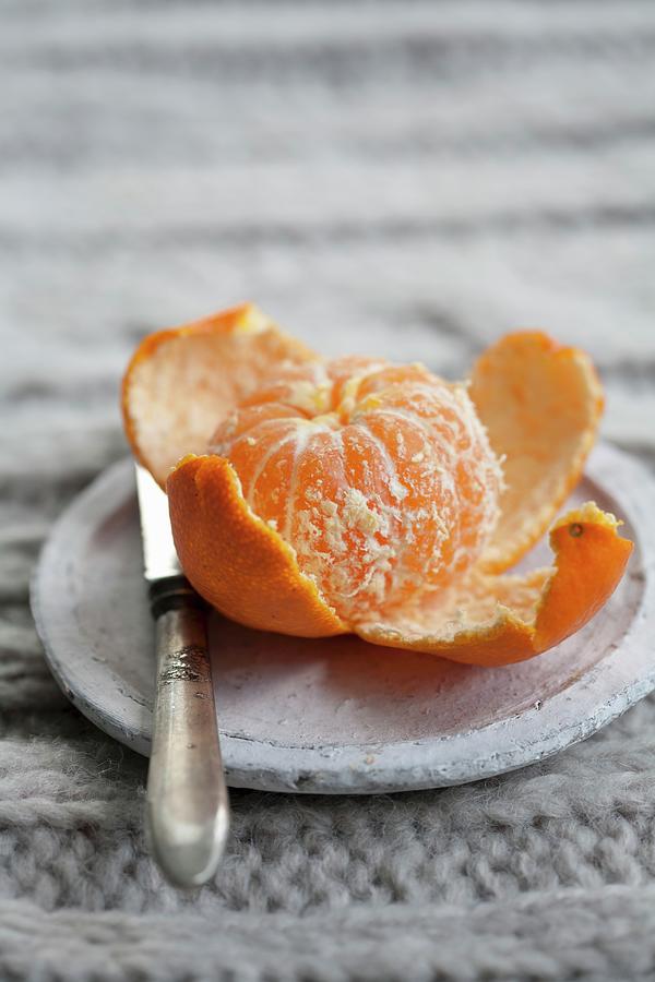 Peeled Mandarin Orange Photograph by Martina Schindler