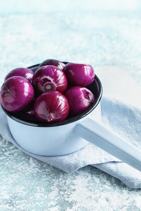 Peeled Purple Onion In Blue Saucepan Photograph by Andrey Maslakov