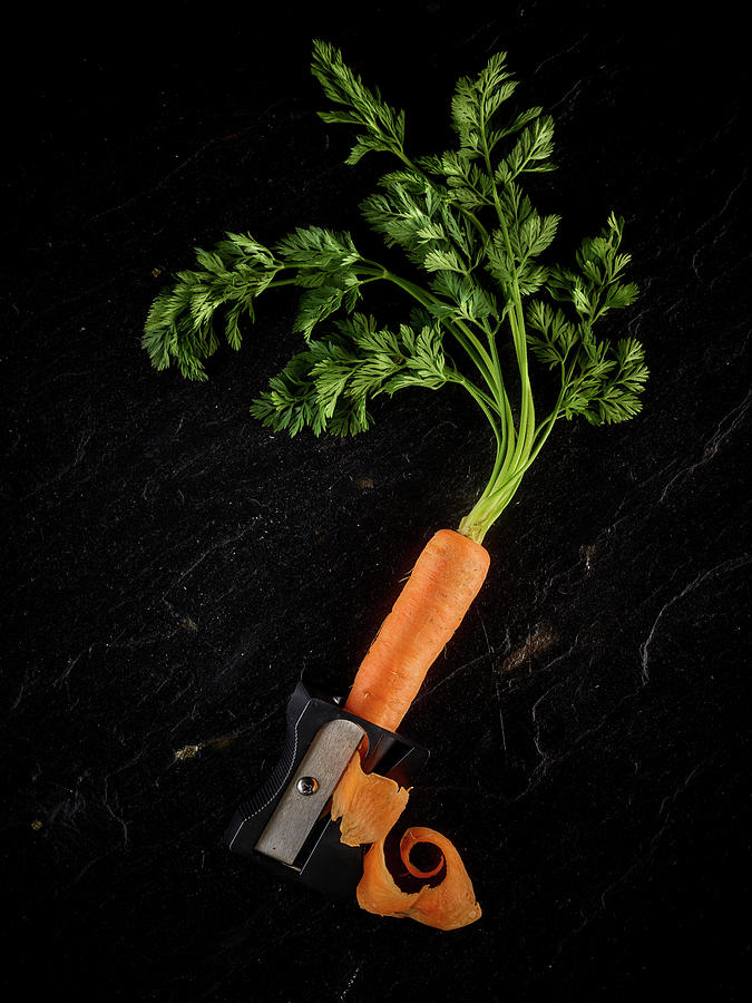 Peeling A Carrot With A Pencil Sharpener Photograph by Amon